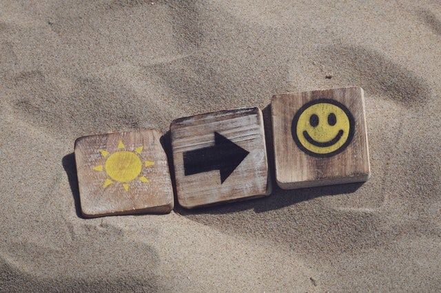 happy sun blocks in the sand
